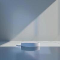 An empty white pedestal in front of a window photo