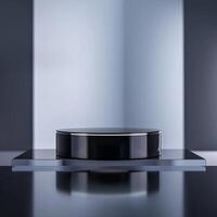 A black object on a table in front of a wall photo