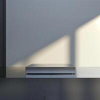 A white box sitting on a table in front of a window photo