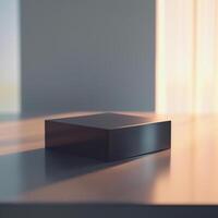 A black box sitting on a table in front of a window photo