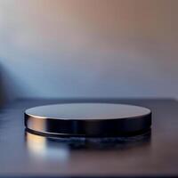 A black circular object on top of a table photo
