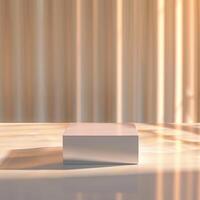An empty box sitting on a table in front of a curtain photo