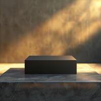 Black box on marble table with sunlight coming through photo