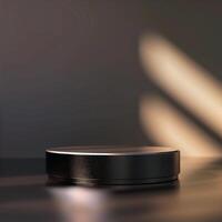 A black round object on a table with light coming from the side photo