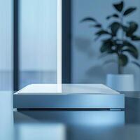 A white box sitting on a table in front of a window photo