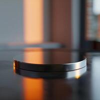 A round object on a table with a reflection of the sun photo