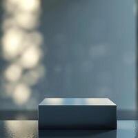 An empty box sitting on a table in front of a window photo