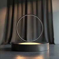 A circular light on a pedestal in front of a curtain photo
