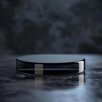 A black circular object sitting on a table photo