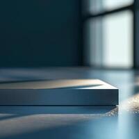 A white box sitting on a table in front of a window photo