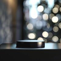 A black object on a table in front of a blurred background photo