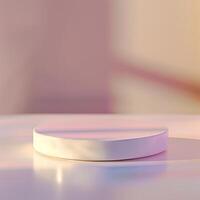 A white round object on a table with a pink background photo