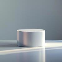 A white round table on a table with a light shining on it photo