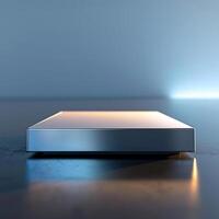 A silver box sitting on a table with a light shining on it photo