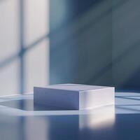 A white box sitting on a floor in front of a window photo