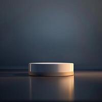 A white round object on a table in front of a dark background photo