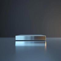 A silver box sitting on a table in front of a dark background photo
