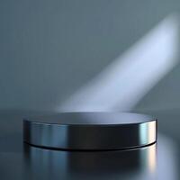 A round metal podium on a table with light shining on it photo