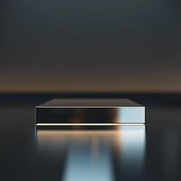 A silver box sitting on a table in front of a dark background photo