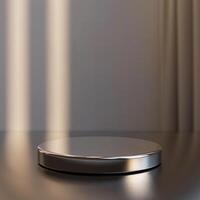 A silver object on a table with sunlight coming in through the window photo