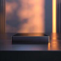 A black box sitting on a table in front of a window photo