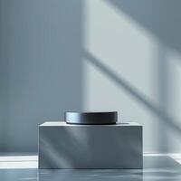 A white box with a black object on top photo