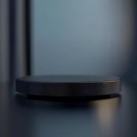 A black circular object on a table photo
