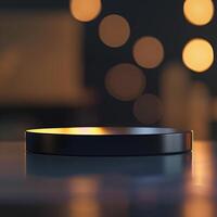 A black object sitting on a table in front of a blurry background photo