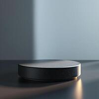 A black object on a table with a light shining on it photo