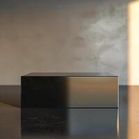 A black box sitting on a table in front of a wall photo