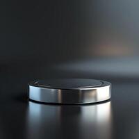 A silver object on a table with a light photo