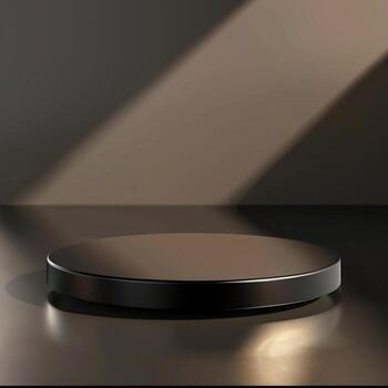 An empty black round table on a table with a light shining on it photo