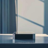 A box sitting on a table in front of a window photo