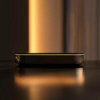 A black and gold device sitting on a table photo