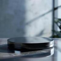 A black circular object on a table photo