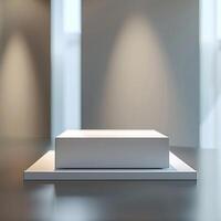 A white box sitting on a table in front of a window photo