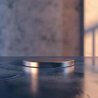 A metal object on a table in front of a wall photo