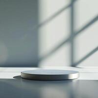 A white round table in front of a window photo