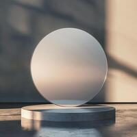 A large mirror on a pedestal in front of a wall photo