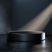 A black round table in a dark room with a spotlight photo