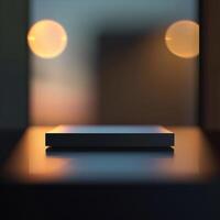 A black box sitting on a table in front of a window photo