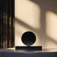 A black object on a table in front of a window photo