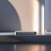 A white box sitting on a table in front of a window photo