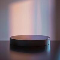 A black round table on a table with a light behind it photo