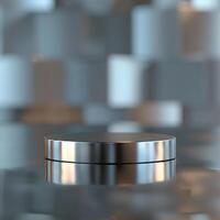 A silver round object on a table in front of a wall photo