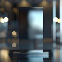 A black glass display on a table in front of a large mirror photo