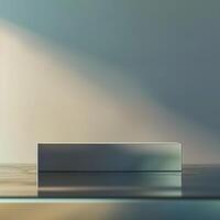 A silver box sitting on a table in front of a wall photo