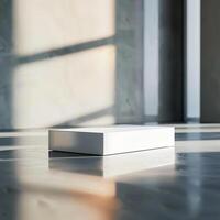 A white box sitting on a floor in front of a window photo