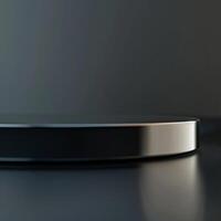 A black and silver circular object on a table photo