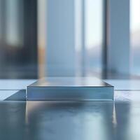A glass box sitting on a table in front of a window photo
